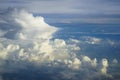 View of abstract dense soft fluffy white cloud copyspace with shades of blue sky and earth background from above flying airplane Royalty Free Stock Photo