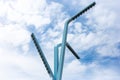 View of abstract lampposts on the background of blue sky. Royalty Free Stock Photo