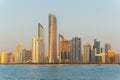 View of Abu Dhabi financial district skyline at golden hour. Luxury lifestyle hotels and business of United Arab Emirates.