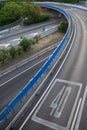 View of access curve to M30 with 40 km limit, empty, at sunset, in Madrid, Spain