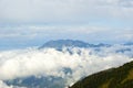 A view of the Achishkho mountain in the Caucasus from the pass Bzerpinsky cornice, towering above the clouds