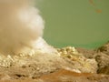 View on the acidic crater lake of the Ijen volcano in Indonesia, a sulfur mine and toxic gaz Royalty Free Stock Photo