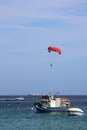 Boat parasailing over Mellieha Bay, Malta