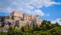 View of Acropolis hill from Areopagus hill on summer day with great clouds in blue sky, Athens, Greece. UNESCO heritage Royalty Free Stock Photo