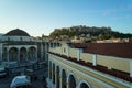 View of the Acropolis from Monastiraki metro station through old town buildings and Tsisdarakis Mosque, Athens