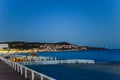 View across the bay from Nice, France, to the city shining with bright lights at dusk Royalty Free Stock Photo