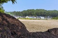 A view across the beach back towards the village of Llansteffan, Wales