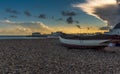 A view across the beach out to sea at Worthing, Sussex, UK at sunset Royalty Free Stock Photo