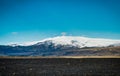 View across black beach towards eyjafjallajokull volcano