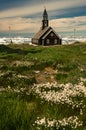 View across the meadow to a Zion church in Ilulissat, Greenland