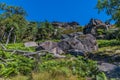 A view across boulders looking up towards the summit of the Roaches, Staffordshire, UK