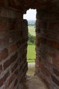 A view across the castle loophole on the landscape