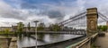 A view across the Clyde at the Portland Street Suspension Bridge in Glasgow Royalty Free Stock Photo