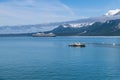 A view across Disenchartment Bay towards icebergs and a cruise ship in Alaska Royalty Free Stock Photo