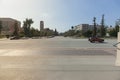 View across and down wide city streets from City Hall