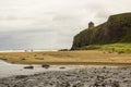 A view across Downhill beach in County Londonderry in Northern Ireland with a train heading toward Mussenden Temple Royalty Free Stock Photo