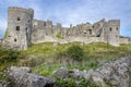 A view across a dry stone wall of the ruins of the old castle at Carew, Pembrokeshire, UK Royalty Free Stock Photo