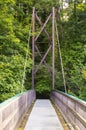 A view across the Inverted Bowstring Bridge across the Roe river in the Roe Valley country park near Limavady in County Londonderr