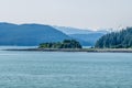 A view across an islet in the Gastineau Channel on the approach to Juneau, Alaska Royalty Free Stock Photo