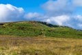 A view across the moorland towards a peak above the town of Ilkley Yorkshire, UK Royalty Free Stock Photo