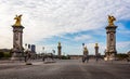 View across the ornate Alexander III Bridge spanning the Seine River and gilt bronze statues in Paris Royalty Free Stock Photo