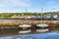 A view across the outer harbour wall and town of Queensferry, Scotland