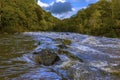 A view across rapids on the river Teifi at Cenarth, Wales after heavy rainfall