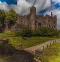 A view across the river Coran towards the castle at Laugharne, Wales Royalty Free Stock Photo