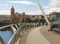 A view across the River Foyle from the iconic Peace Bridge to the famous Londonderry City Guild Hall Royalty Free Stock Photo