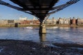 View across the River Thames from the South Bank underneath the Millennium Bridge, London Royalty Free Stock Photo