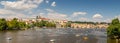 waterfront view across the river Vltava with pedal boats to Prague Castle and Charles Bridge, Prague, Czech republic Royalty Free Stock Photo