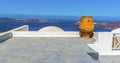 A view across a roof top in the village of Imerovigli, Santorini towards Thirasia and Oia Royalty Free Stock Photo