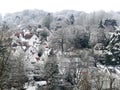 View across roof tops in the village of Chorleywood, Hertfordshire, UK in winter snow