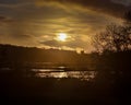 View across Silverdale Moss to sunset behind Arnside Tower