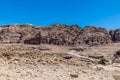 A view across the valley down the main thoroughfare towards the Royal Tombs in the ancient city of Petra, Jordan Royalty Free Stock Photo
