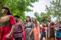 View of actors dressed in medieval clothes on medieval market, blurred background