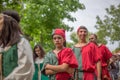 View of actors dressed in medieval clothes on medieval market, blurred background