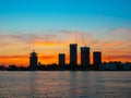 View of Adam tower and other nodern buildings during orange sunset, Amsterdam, Netherlands