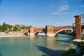 View of Adige river and medieval stone bridge of Ponte Scaligero near Castelvecchio in Verona, Italy Royalty Free Stock Photo