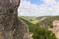 View of adjacent passage between hills from fortress wall of ruins of residence of Grand Masters of Teutonic Order in ruins of