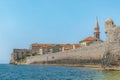 View from the Adriatic Sea to the fortification walls of Budva Old Town Royalty Free Stock Photo