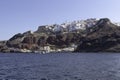 View of the town of Oia with its port and the Byzantine Castle Ruins, Santorini Island, Cyclades, Greece Royalty Free Stock Photo