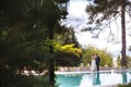 View from afar the bride and groom stroll around the hotel, chatting and spending time together on their wedding day. Royalty Free Stock Photo