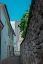 View from afar  of a church and bell tower in the medieval village of Motovun in Croatian Istria. Frog view overlooking the square Royalty Free Stock Photo