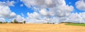 View of agricultural fields under sky with clouds, in the historical province Gascony, the region of Occitanie of southwestern Fra