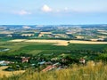 A view of the agricultural landscape of South Moravia around Mikulov. Fields and vineyard under blue summer sky. Suitable for Royalty Free Stock Photo