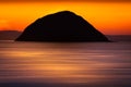 View of Ailsa Craig island with beautiful orange evening sunset Royalty Free Stock Photo