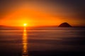 View of Ailsa Craig island with stunning orange sunset Royalty Free Stock Photo