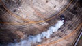 A view from the air racing drift car with a lot of smoke on the Royalty Free Stock Photo