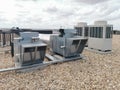 View of air ventilation ducts, extraction and insufflation, HVAC system, and exterior AC units on the building roof Royalty Free Stock Photo